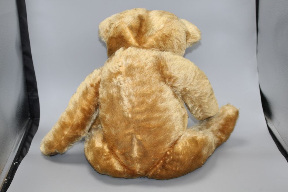 A 1950s Chad Valley bear, 26in., arm label, velvet pads